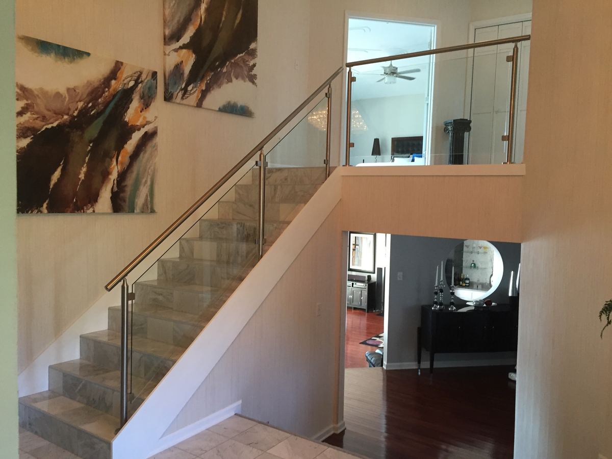 Frameless glass railing installed by Clinton Glass