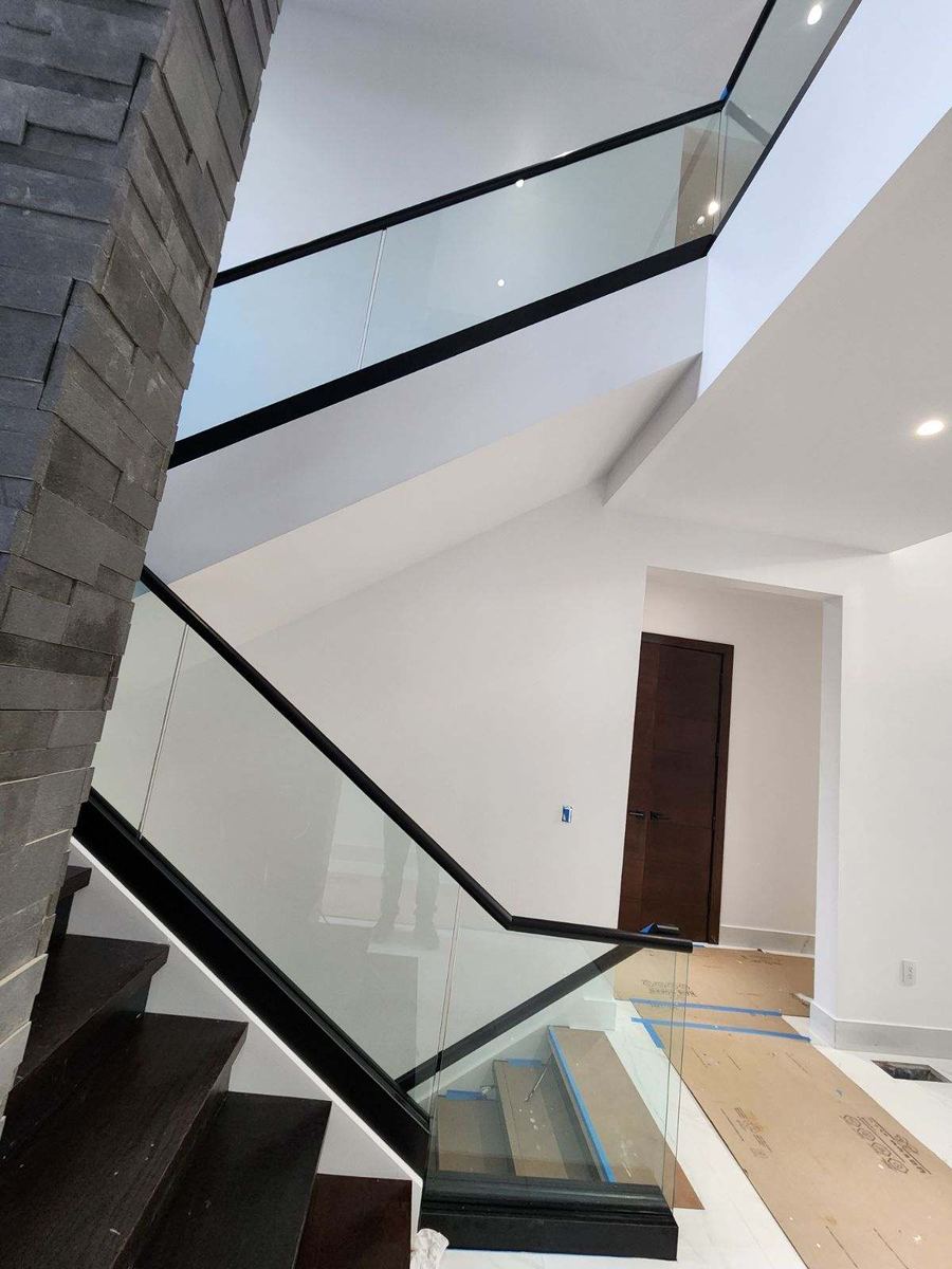 Frameless glass railing installed by Clinton Glass