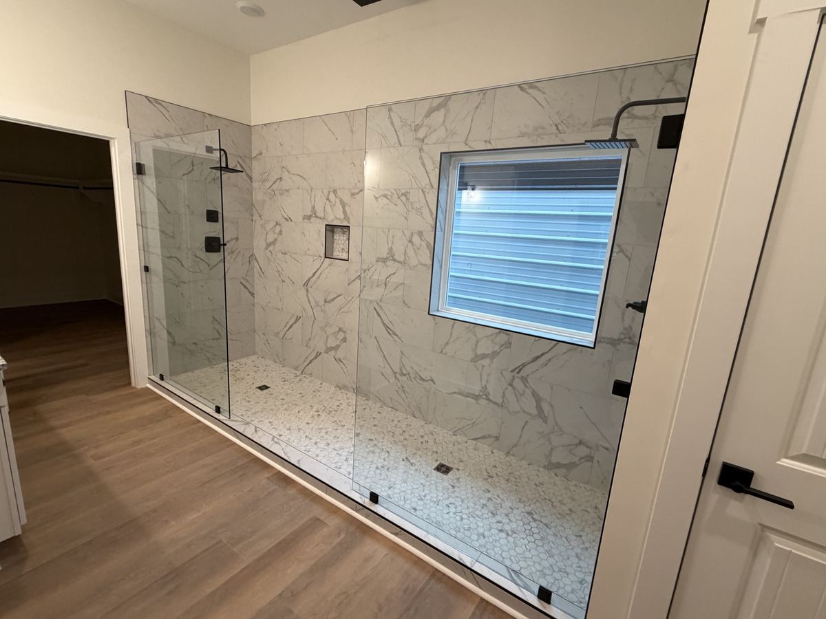 Frameless glass shower installed by Clinton Glass