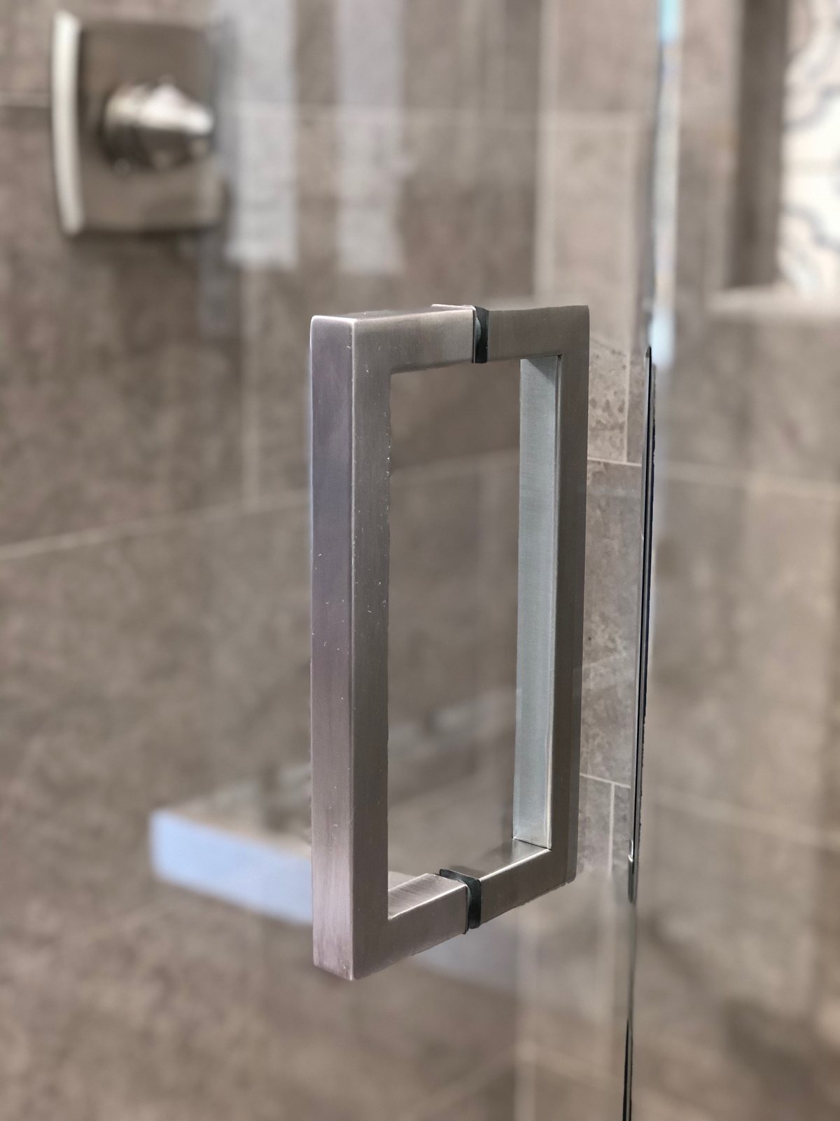 True Square shower door hardware installed by Clinton Glass