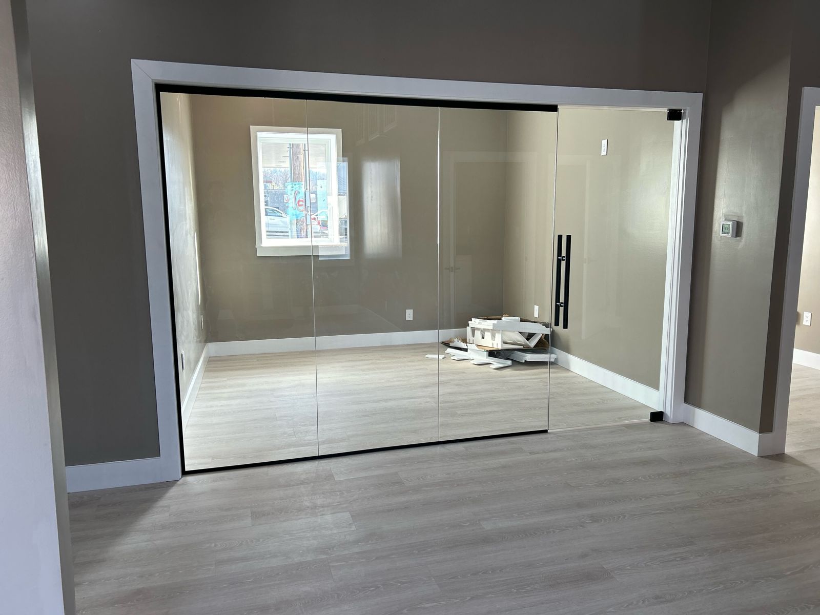 Glass office wall with black trim
