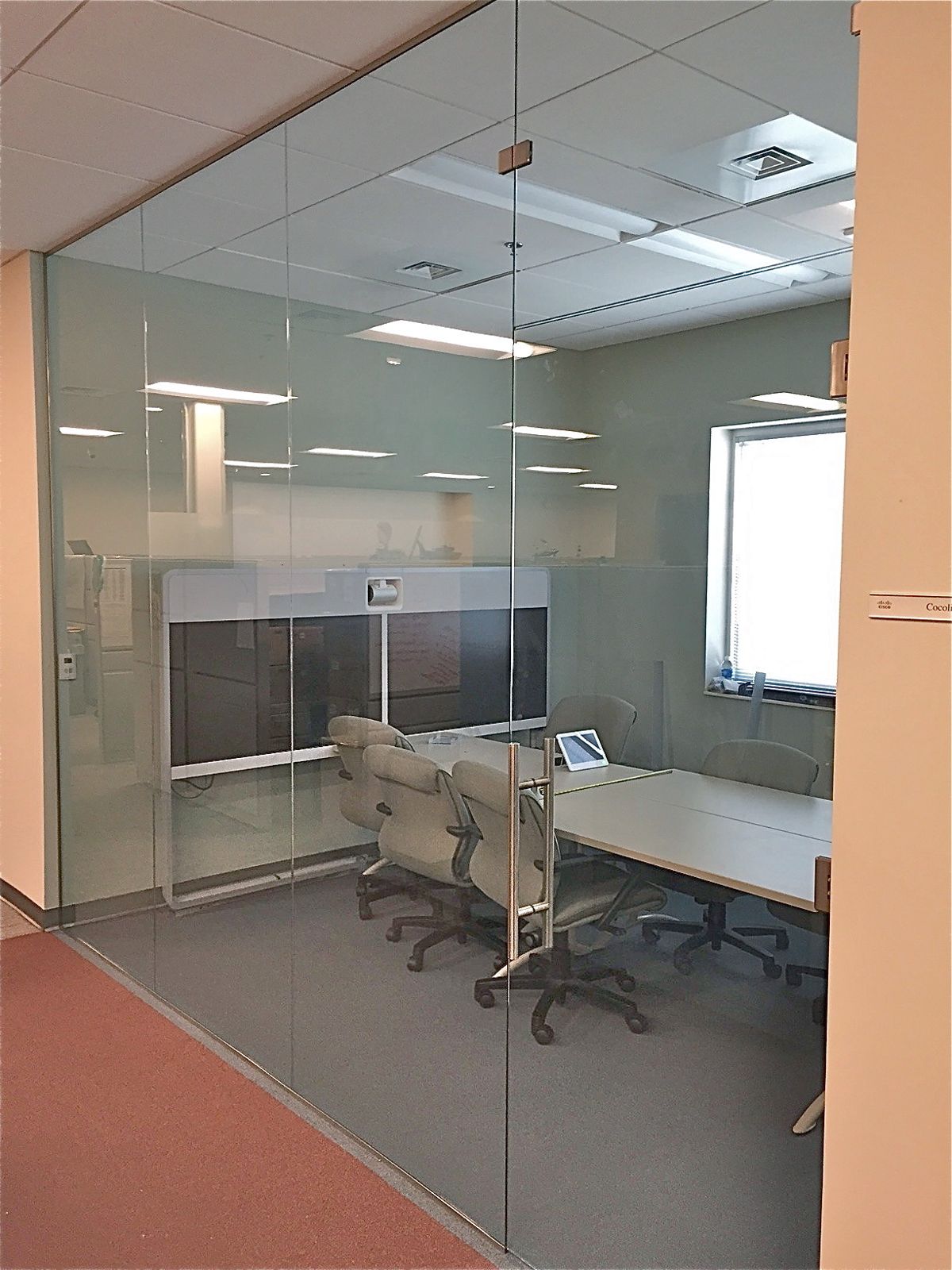Glass partition enclosing an office workspace